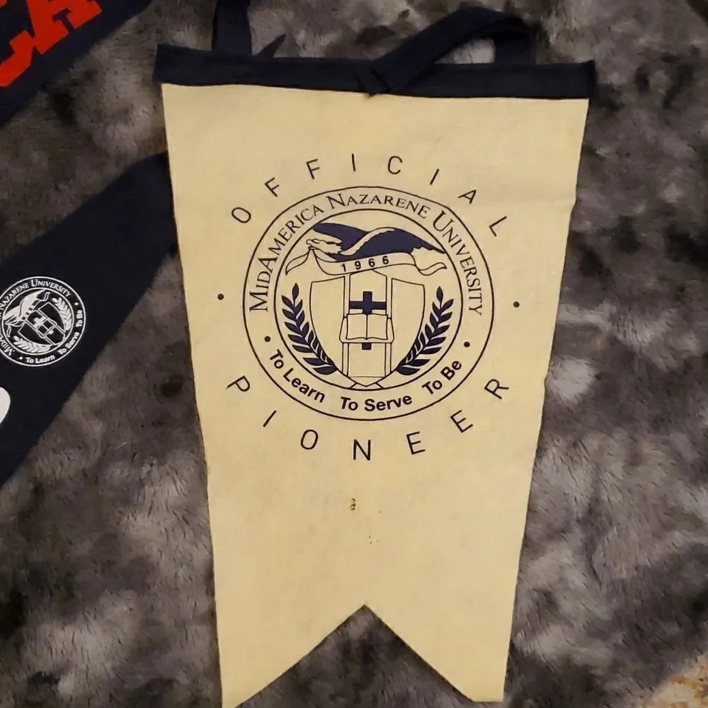 3‎ vtg. MNU  Midamerica Nazarene University felt pendants, pioneers